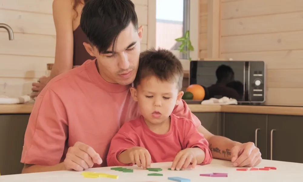 Parent helping child learn