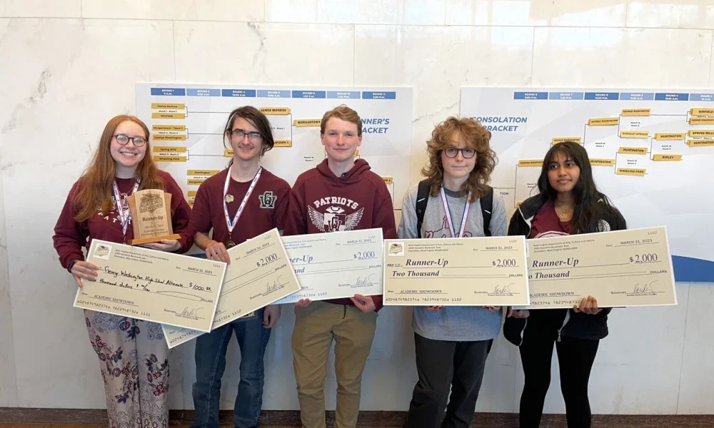 George Washington team holding awards.