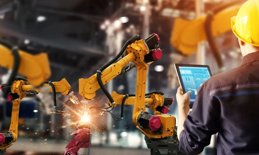 Robotic arm works in a factory