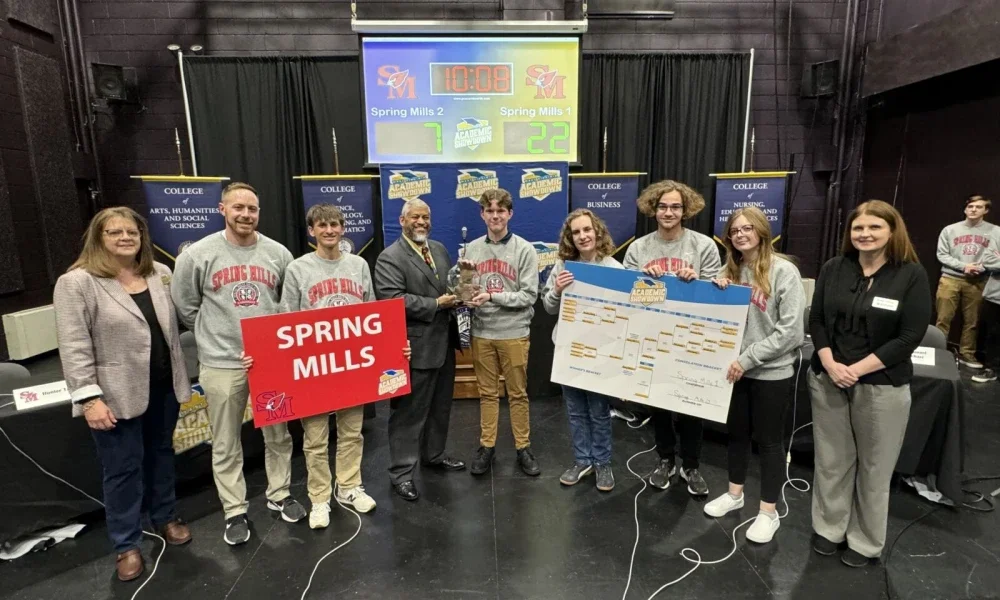 Students pose for photo with second-place trophy