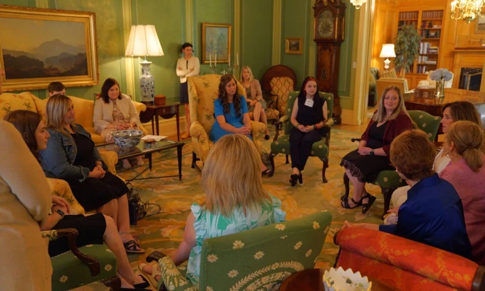 Photo of 2024 Ball Toyota Scholar event attendees conversing in a grand space at the Governor's Mansion.