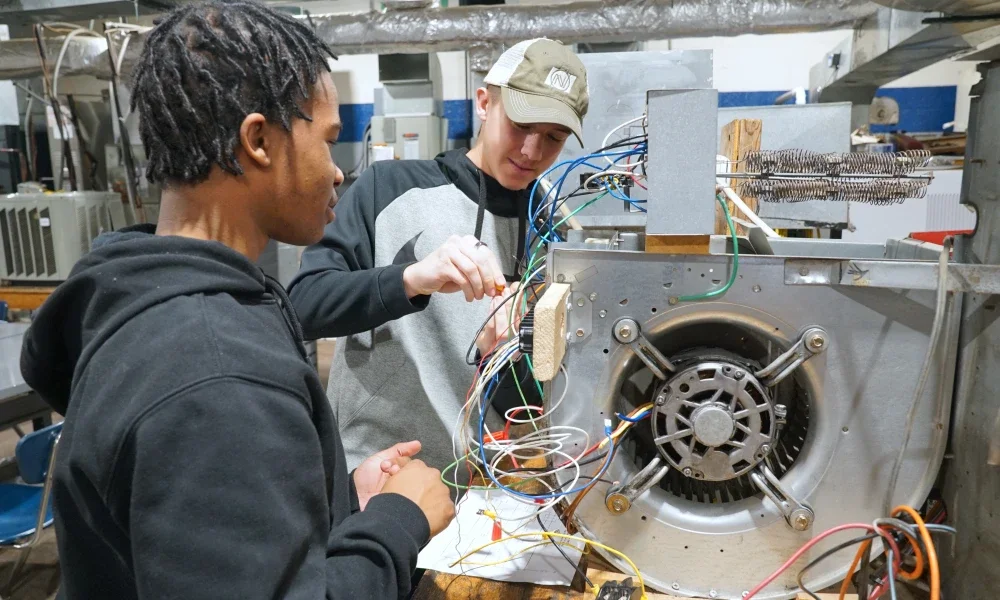 People working on HVAC wiring.