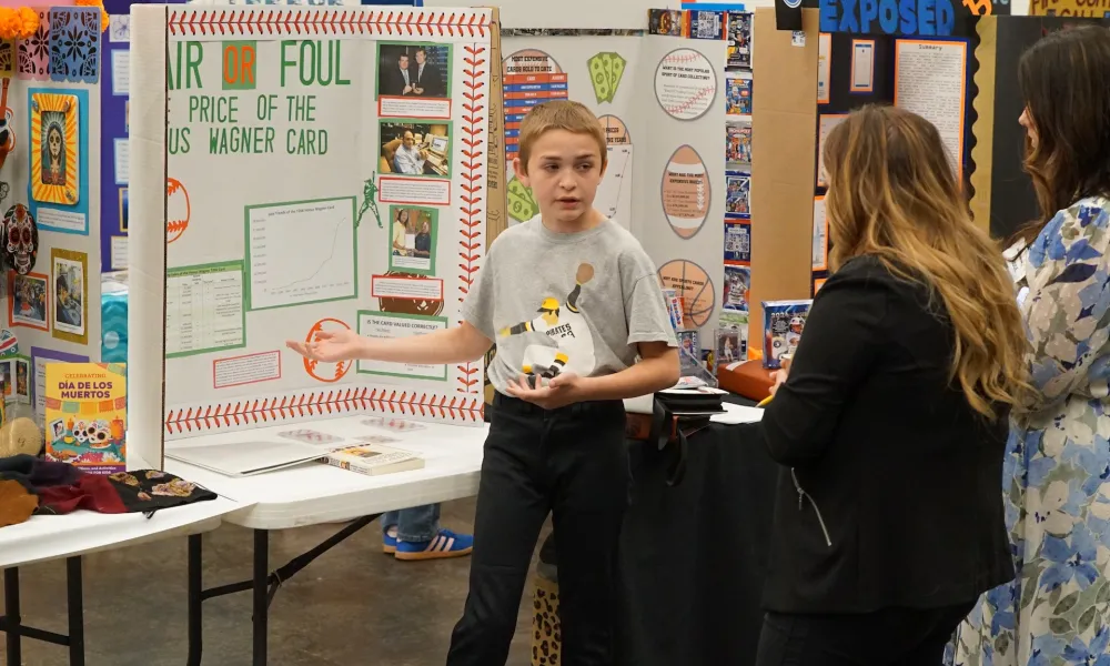 Student presenting his project to judges.