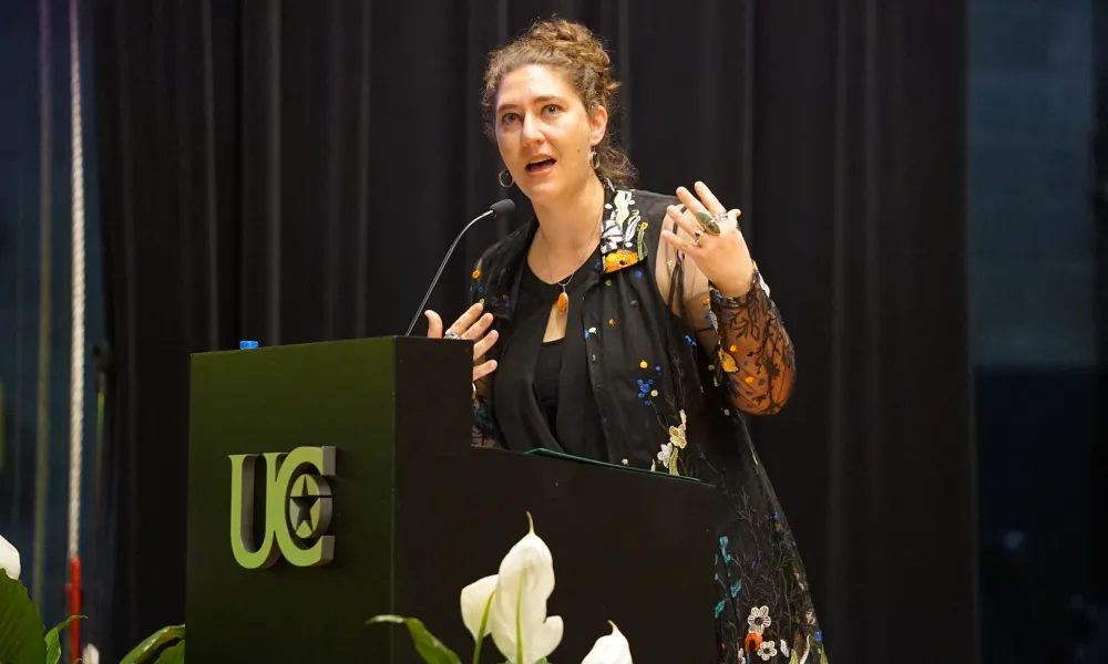 Woman speaking from a podium.