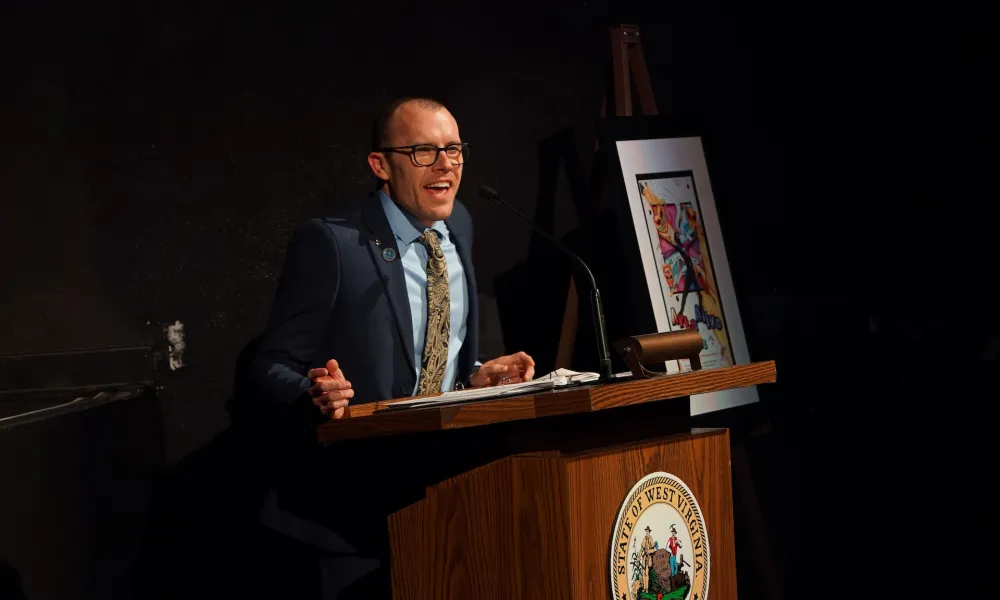 Person speaking from a podium.