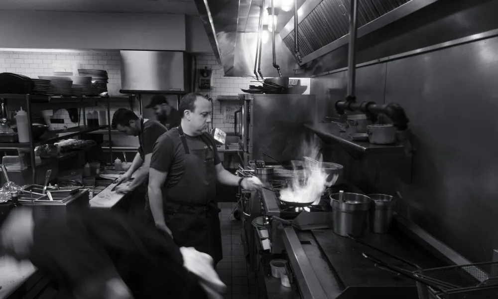 Chef Paul Smith cooking in a kitchen
