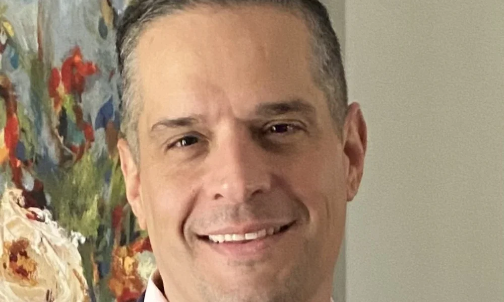 Allen Sexton smiling for a photo.