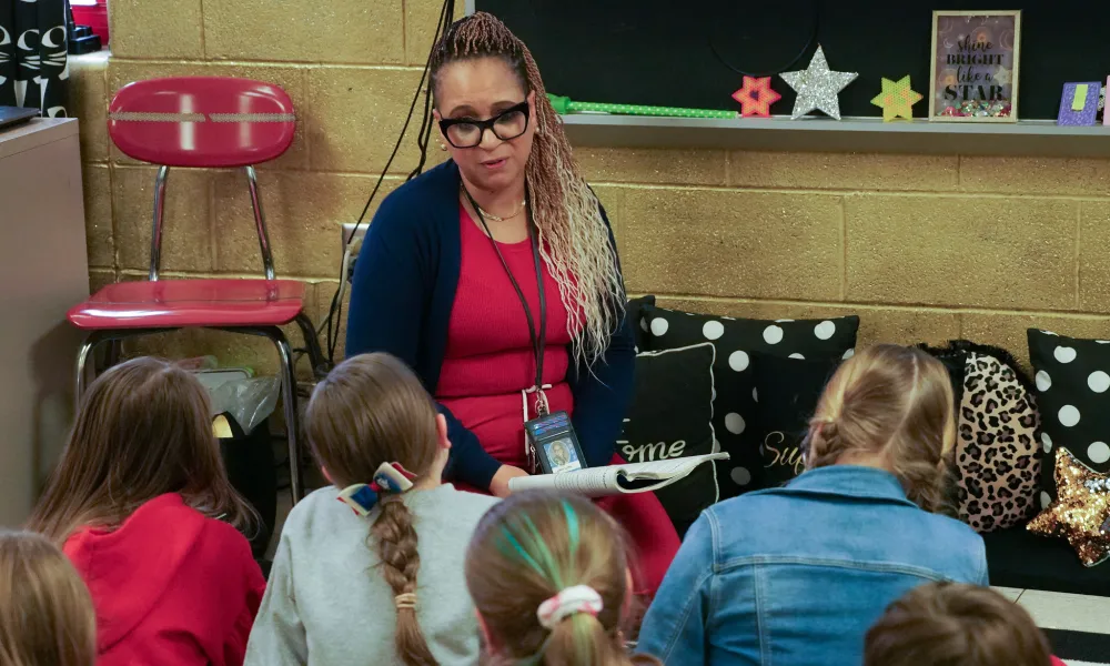 A teacher reading to students.