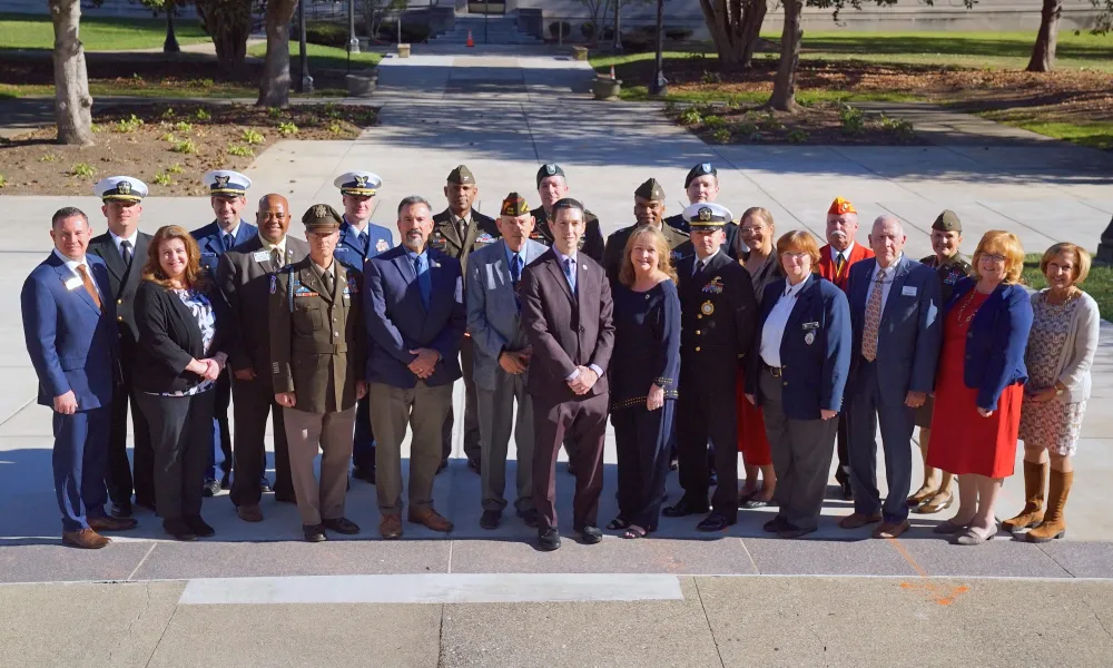 Members of the Common Ground Partnership posing together after the 2024 Compact signing