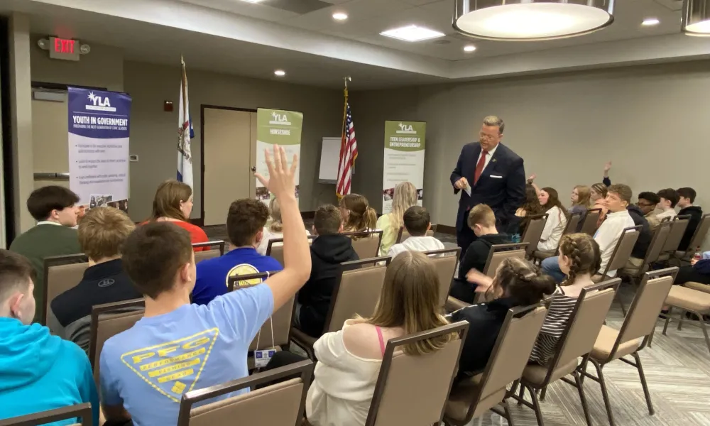 Students participate with a speaker in Youth in Government seminars.