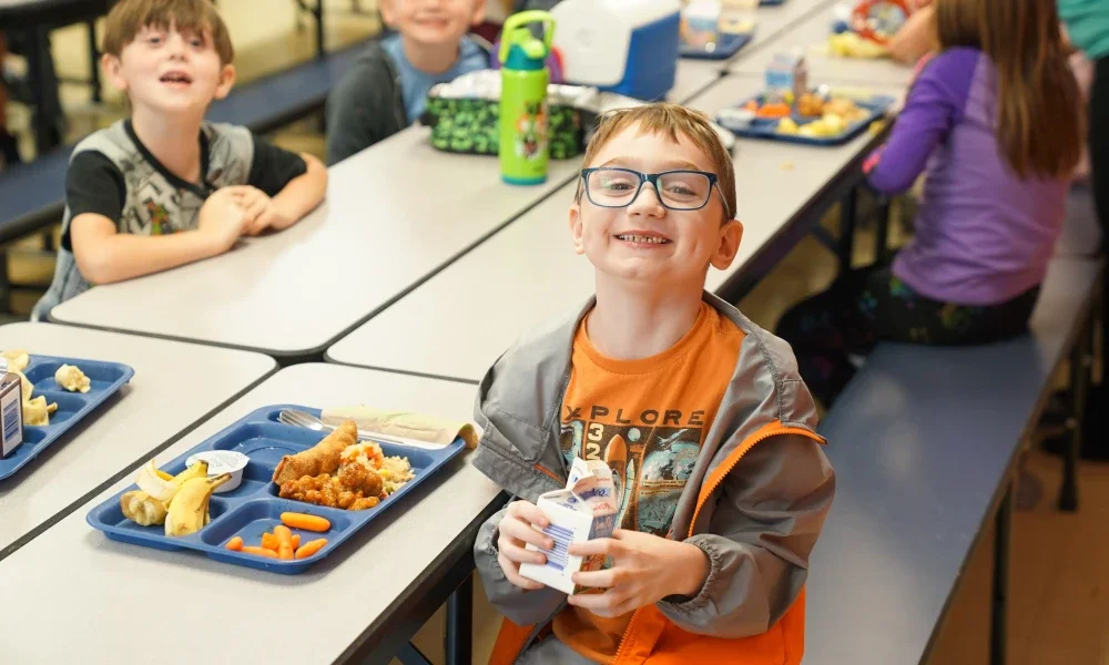 Students eating lunch in a school cafeteria.