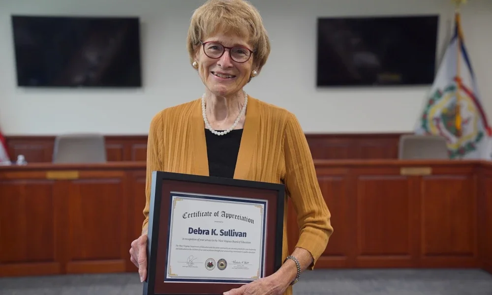 Debra Sullivan holding a certificate