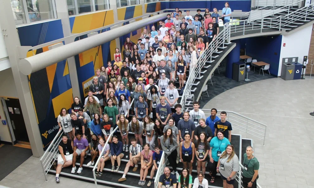 From above, students standing together on a large staircase