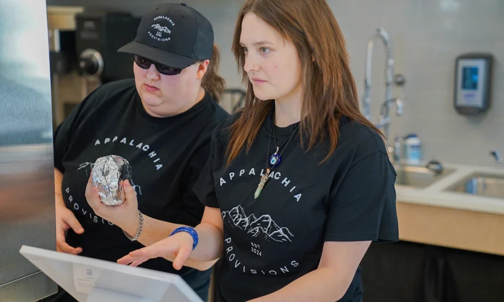 Two students working in a café.