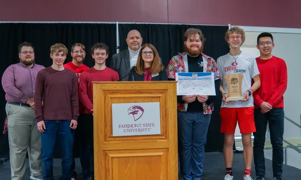 Members of Bridgeport High School's Academic Showdown team holding a trophy.
