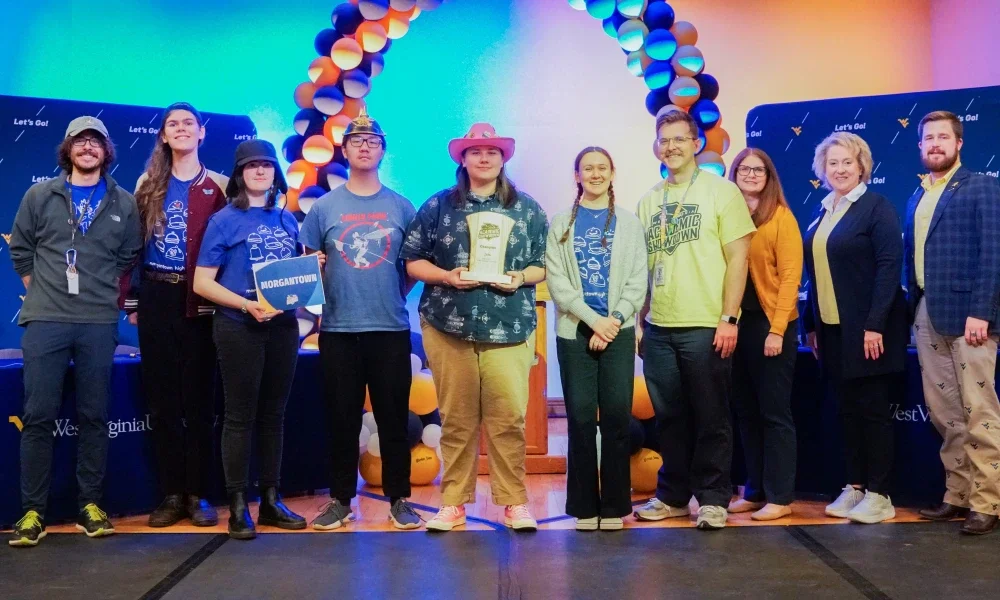 Members of Morgantown High School's Academic Showdown team holding a trophy.