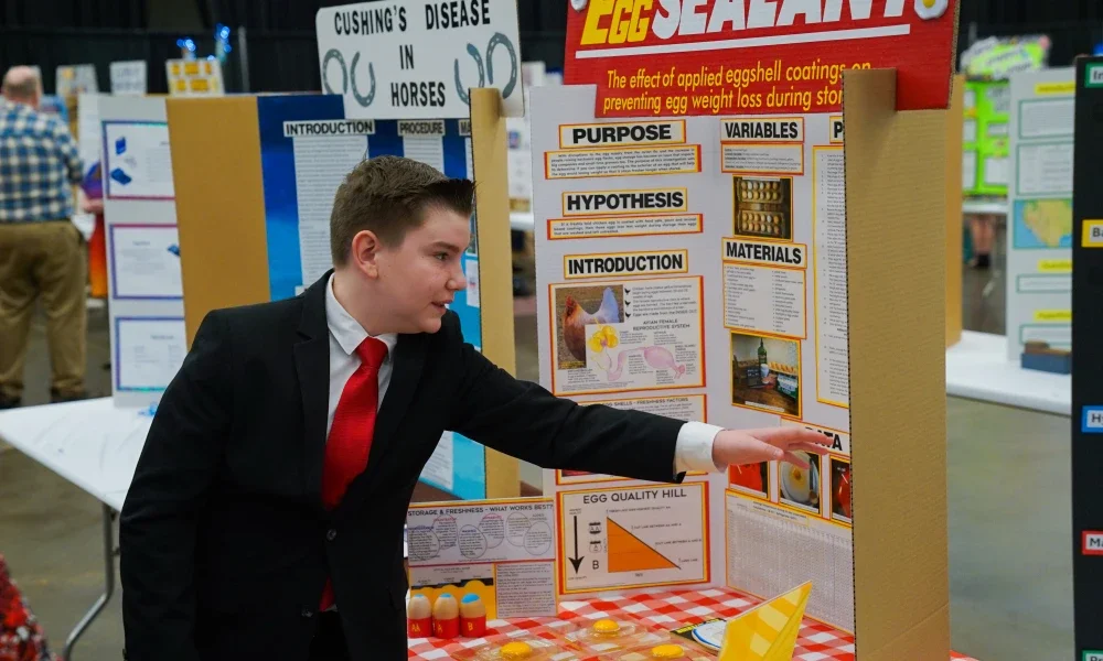 A student pointing to his project.