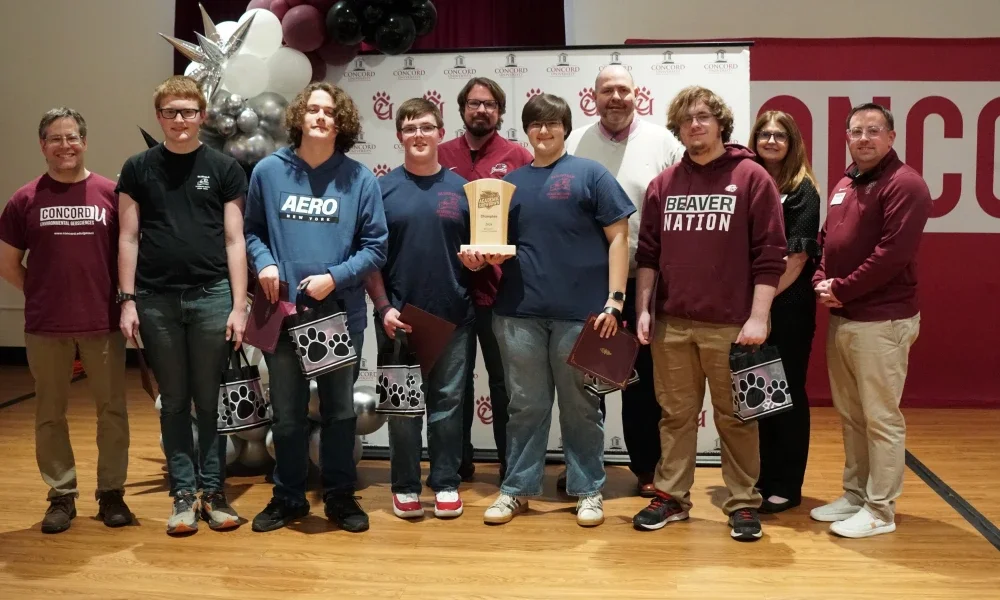Members of Bluefield High School's Academic Showdown team holding a trophy.