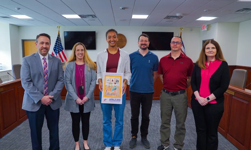 Assistant Superintendent Clinton Burch, Jennifer Stephens, Ayo Buerger, Tom Pickens, Will Garuccio, and Karen Linville smiling.