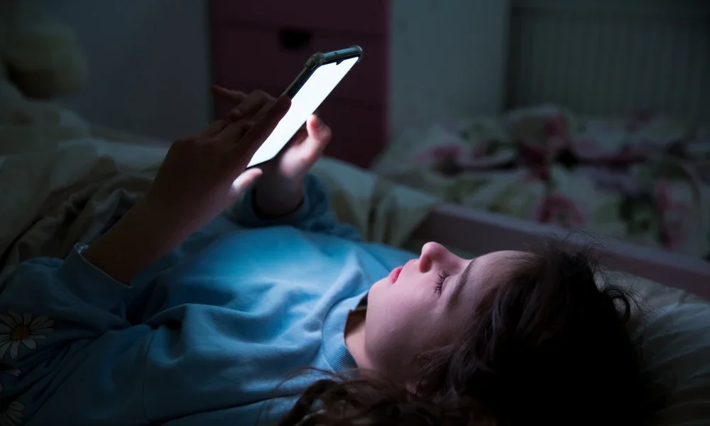 Child using a smartphone unattended.