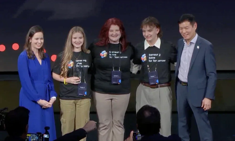 Student representatives from Huff Consolidated Elementary and Middle School smiling while holding an award.