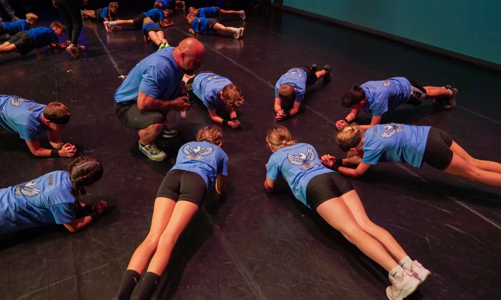 Student doing planks.