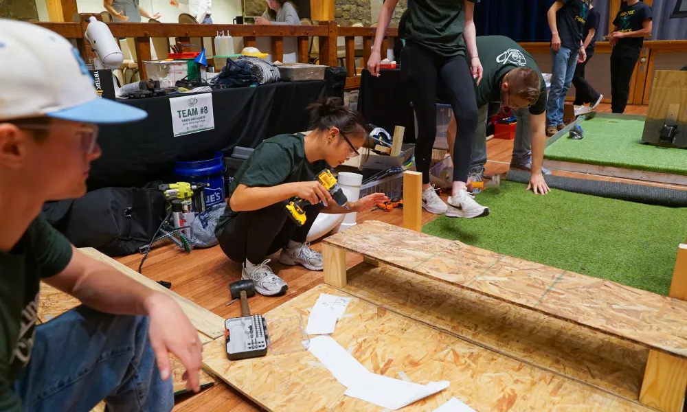 A student working with wood. 