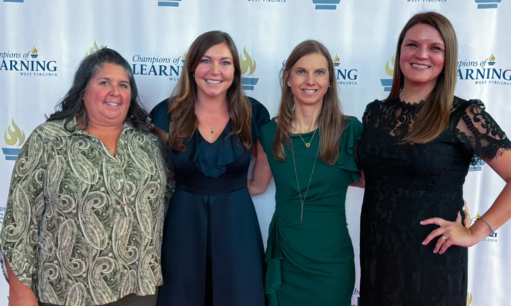 Lisa Cook, Miriam Mason, Alicia Riggleman, and Laura Presley smiling. 