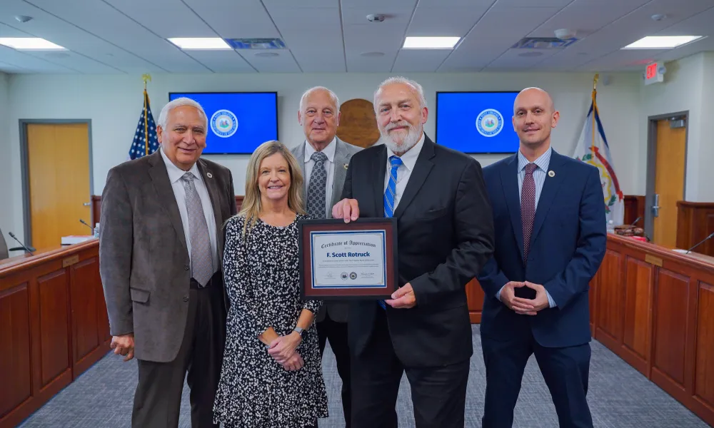 Scott Rotruck and other West Virginia Board of Education members smiling. 