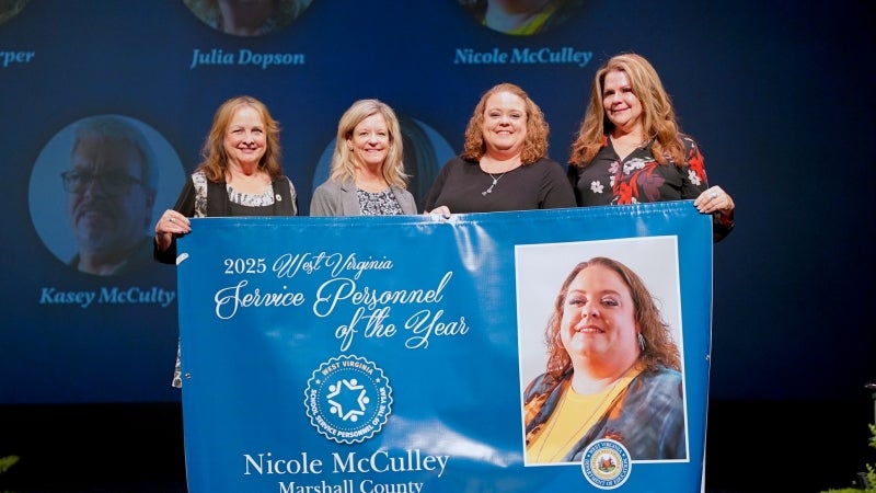 People standing on a stage.