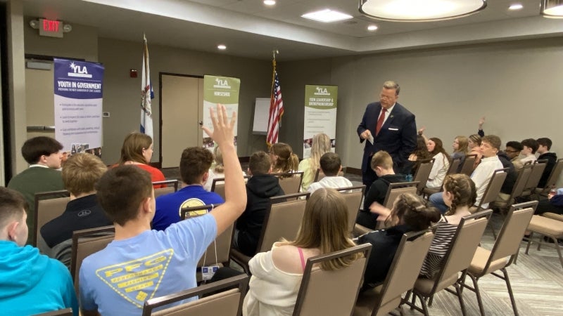 Students participate with a speaker in Youth in Government seminars.