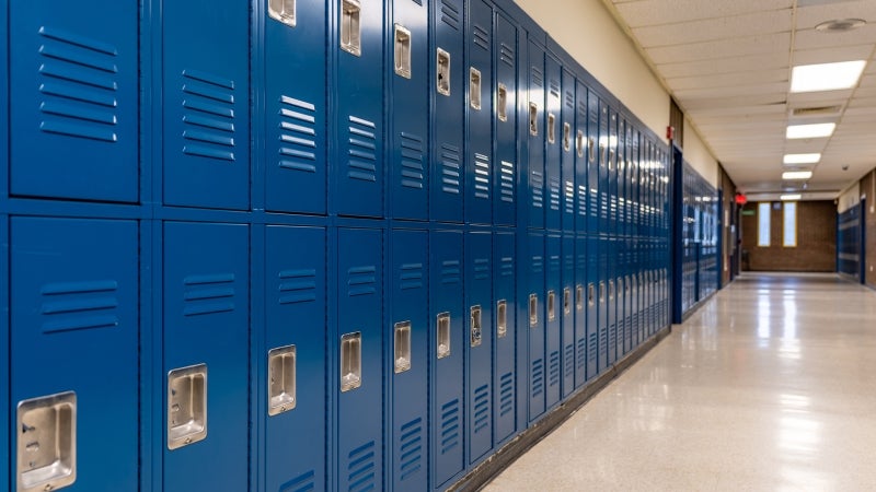 School hallway with blue metal student lockers