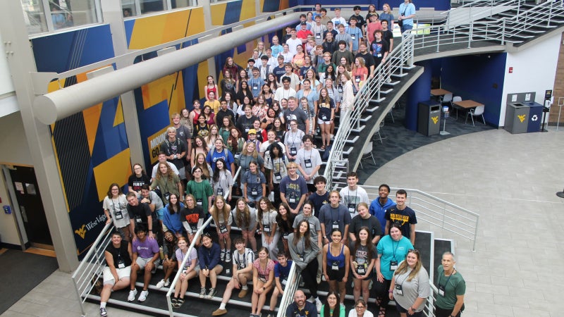 From above, students standing together on a large staircase