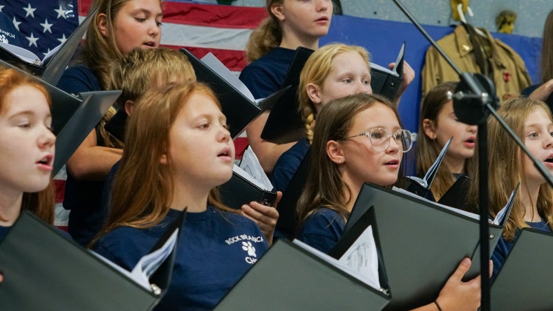Rock Branch Elementary students singing in a group choir during an assembly