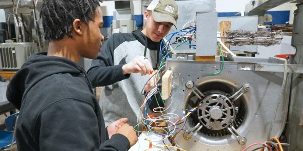 People working on HVAC wiring.