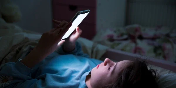 Child using a smartphone unattended.