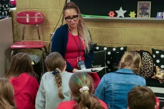 A teacher reading to students.