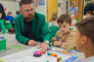 A principal helping students. 
