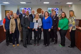 A group photo of the April WVBE meeting and the signed statement of support