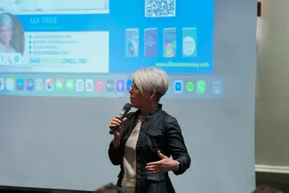 A person speaking into a microphone. 