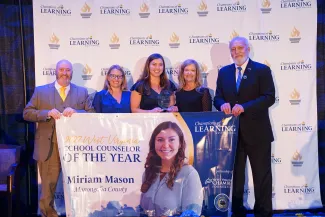 Miriam Mason and others smiling. 