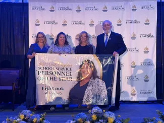 Lisa Cook and others smiling. 