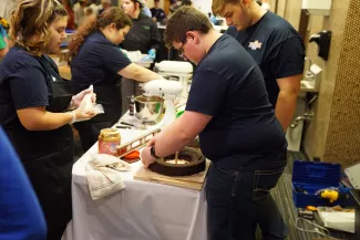 Students working on cakes. 