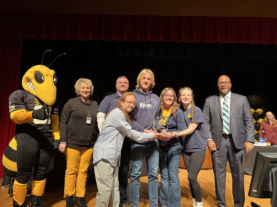 Pictured are students holding a second place trophy.