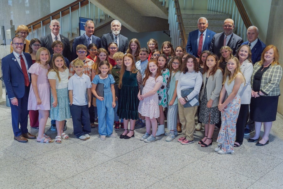 Seth Skiles, West Virginia Board of Education members, and students posing for a photo.