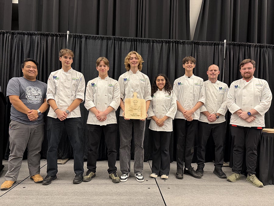 Members of Monongalia County Technical Education Center, University High School and Morgantown High School's Culineering Challenge team smiling. 