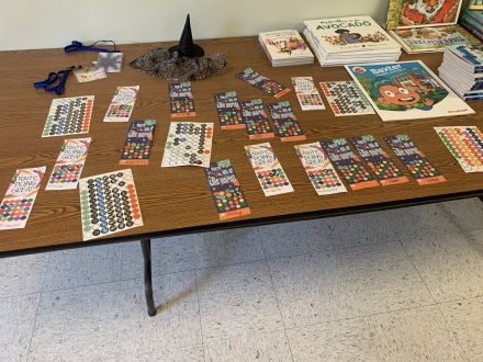 A table with stickers and other activities on it.