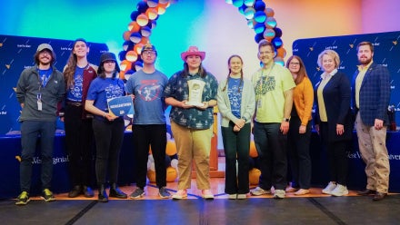 Members of Morgantown High School's Academic Showdown team holding a trophy.