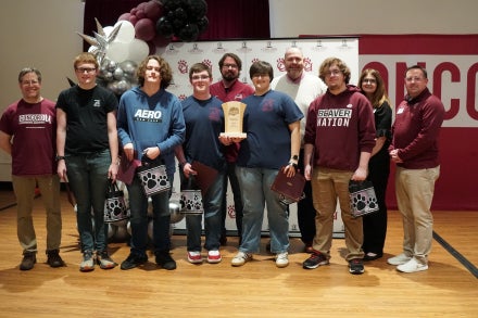 Members of Bluefield High School's Academic Showdown team holding a trophy.