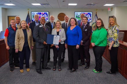 Members of the West Virginia Board of Education and military partnership representatives smiling.